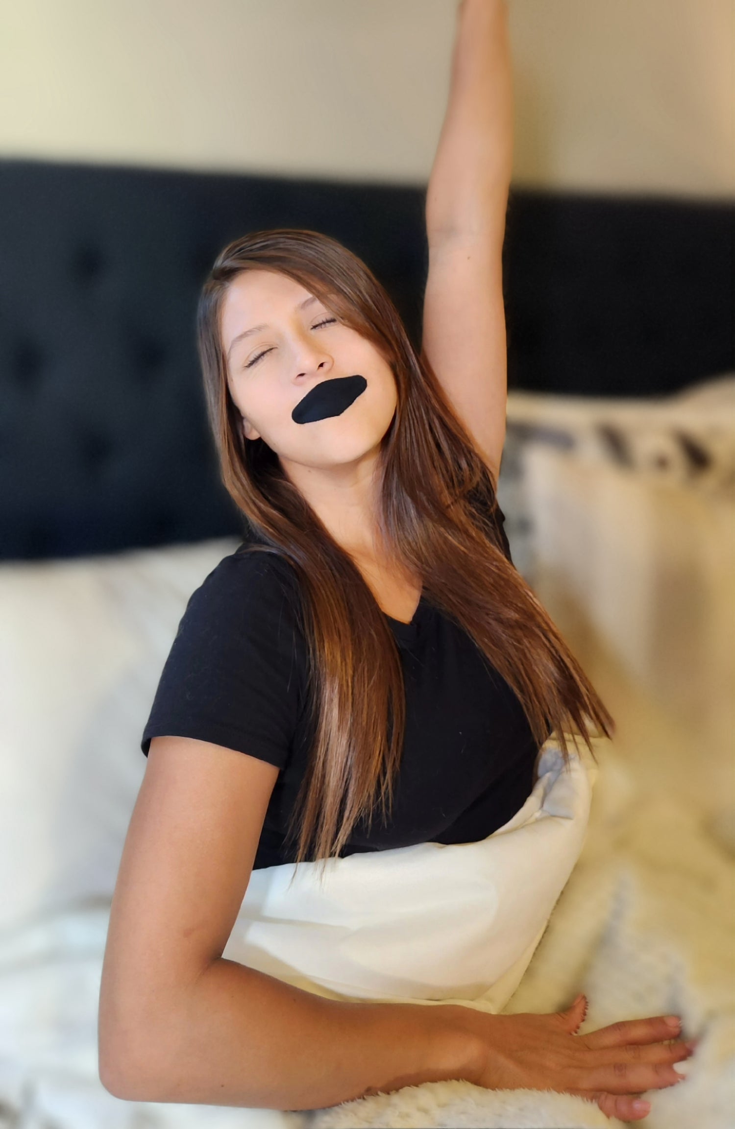 a woman wakes up with mouth taping